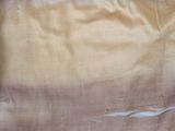 a close up of a piece of fabric with a hole in it