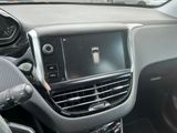 a picture of a car dashboard with a phone in it