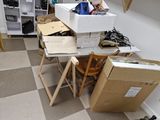 a pile of boxes sitting on top of a table in a room