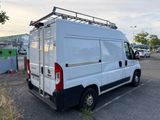 a white van that is parked in a parking lot