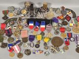 a lot of medals and medals on a table