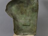 an image of a sculpture of a man ' s head on a wooden base