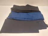four pairs of men ' s pants stacked on top of each other