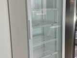 a refrigerator that is sitting in the middle of a kitchen