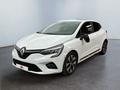 a white car parked in a room with a black floor