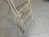 a ladder that is sitting on the floor in a room