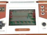 a close up of a game console with a game on the screen