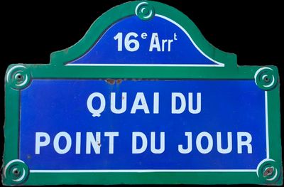 blue and white street sign on a black background that says quai du point du jour