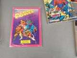 several comic books are on a table next to each other