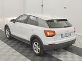a white car that is parked in a garage