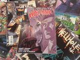 a pile of comic books sitting on a table