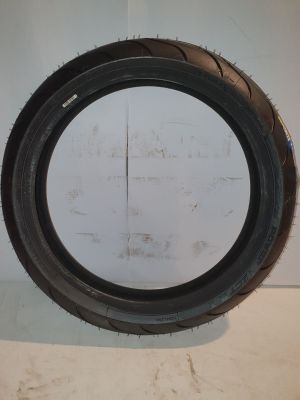 a close up of a tire tire on a white surface