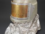 an image of a helmet with a gold helmet on top of it