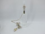 a small bottle with a cord attached to it