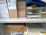 many boxes on the shelves in the room
