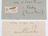 an old envelope with a handwritten letter and a picture of a clock