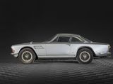 an image of a classic car on a black and white checkered floor