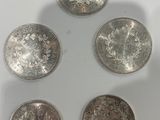 six different british coins are arranged in a circle