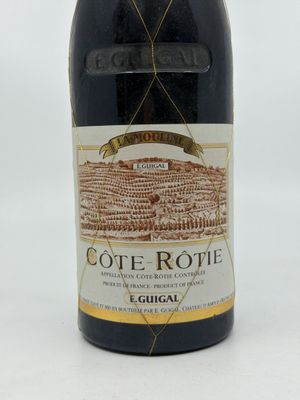 a bottle of wine that is sitting on a table