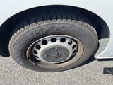 a close up of a tire on the side of a car