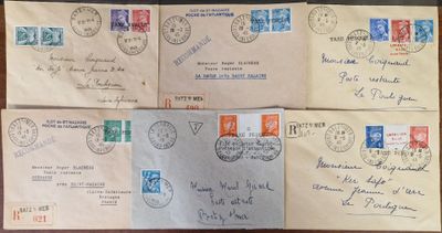 several old envelopes with stamps on them sitting on a table