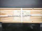 une image représentant une boîte en bois à laquelle est noué un ruban