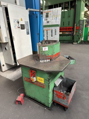 a machine that is sitting on the ground in a factory
