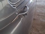 a close up of a car door handle on the side of the car