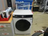a washer and a dryer sitting in a room