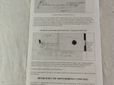 a piece of paper on a table with a piece of paper attached to it