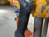 a close up of a hammer on a pallet in a warehouse