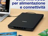 a laptop computer sitting on a desk next to a laptop computer