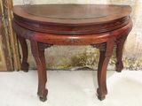a small table with a wooden top on a white floor
