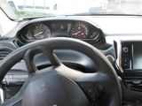 dashboard of a car with a steering wheel and dashboard gauges