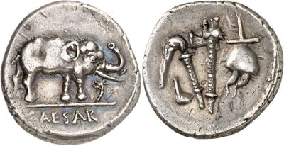 an image of a silver coin with an elephant and a cross on it