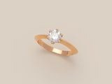 a gold ring with a single diamond in the center