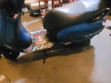 a motor scooter that is parked in a garage