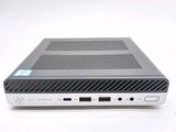 a close up of a small computer on a white surface