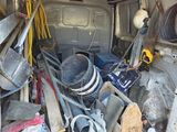 the back of a van filled with tools and other items
