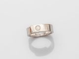 a gold ring with a diamond set in the center