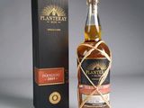 an image of a bottle of whisky next to a box