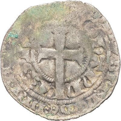 a close up of a coin with a cross on it
