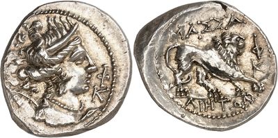 a silver coin with an image of a lion on it