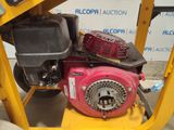 a small engine that is sitting on a cart