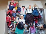a box full of barbie dolls sitting on the floor