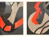 two framed posters of a woman in a red dress and a man in a black suit