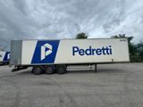 a white truck with a blue and white logo parked in a parking lot