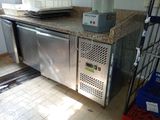 an image of a kitchen with stainless steel appliances and granite counter tops