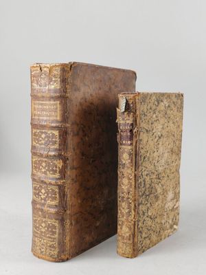 an old book is open to show the inside of it