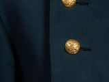 an officer ' s coat with gold buttons on the collar